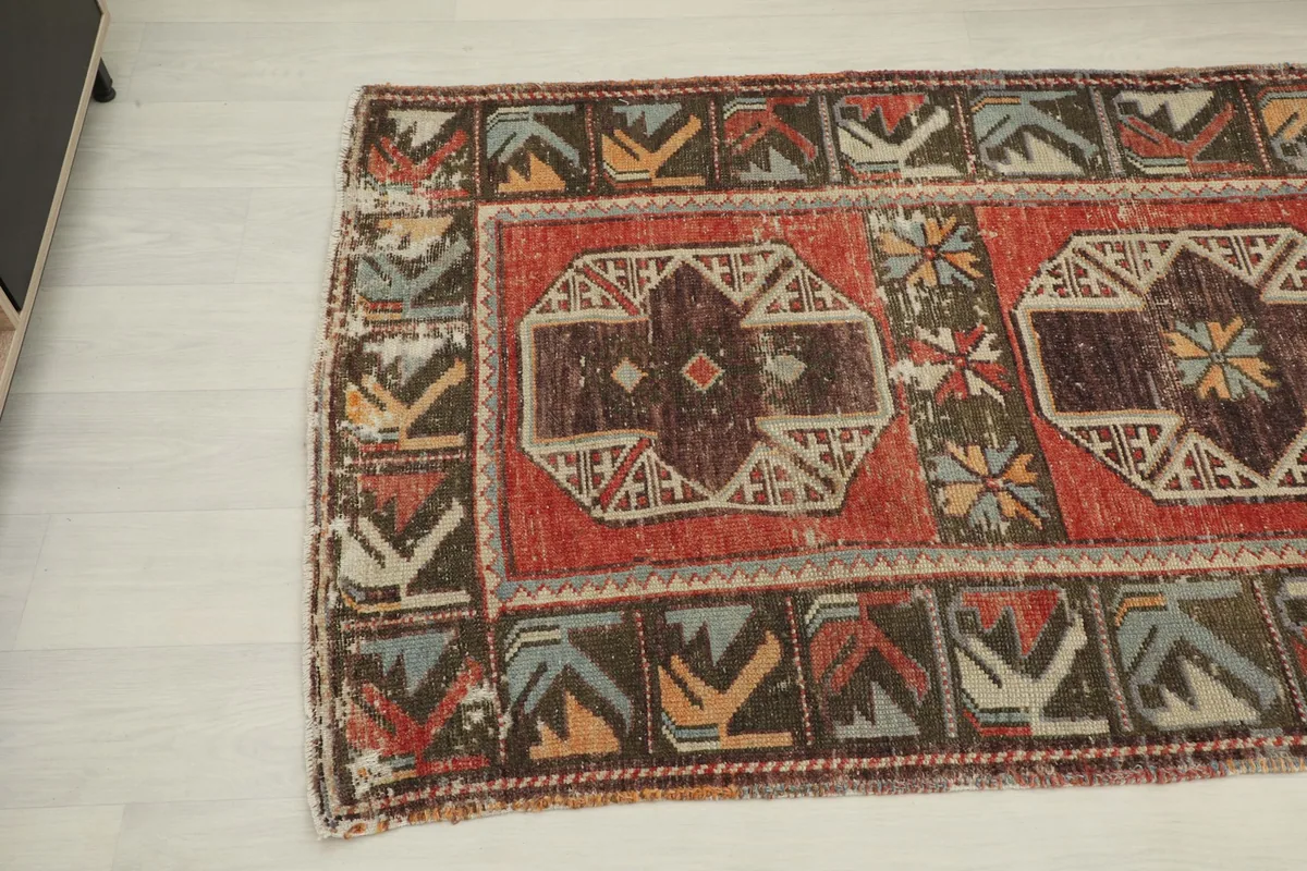 Angled view of the middle section of the runner rug, showing the progression of central medallions