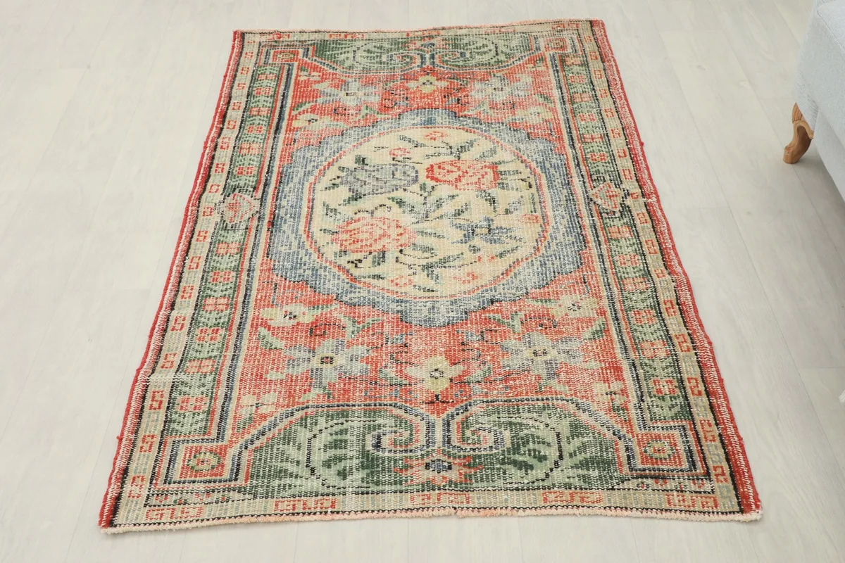 Overhead view of the entire vintage Anatolian rug, showcasing its full design and colors