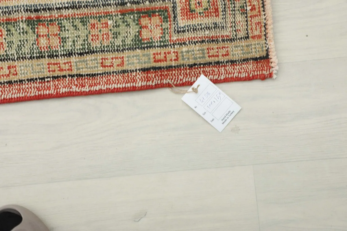 Corner of the rug with the RugsKilim product tag, showing authenticity