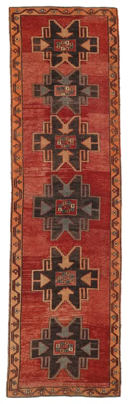 Full overhead view of the Red Anatolian Tribal Runner on a white background