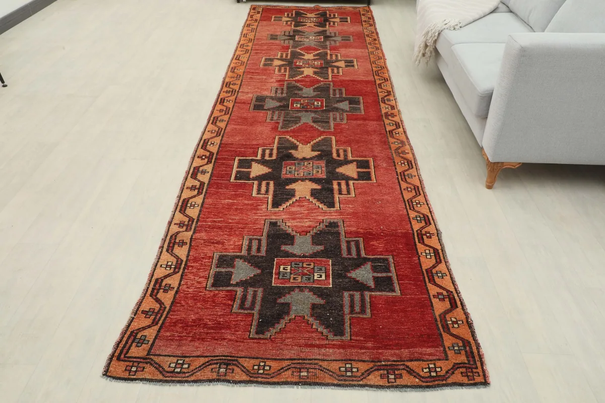 Full overhead view of the Red Anatolian Tribal Runner in a room setting