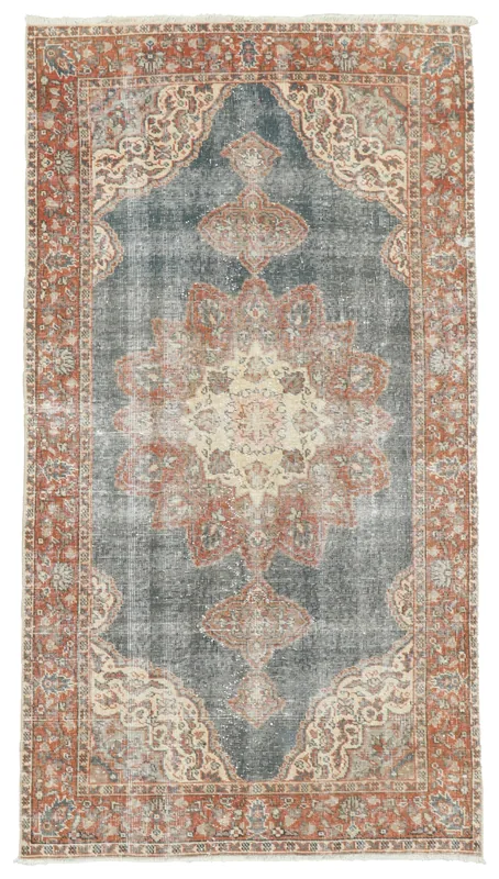 Full top view of the 3'7" x 6'7" vintage hand-knotted area rug with a blue field and rust border