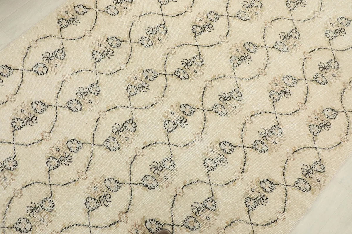 Diagonal view of the rug's pattern, showing the subtle color variations and wear
