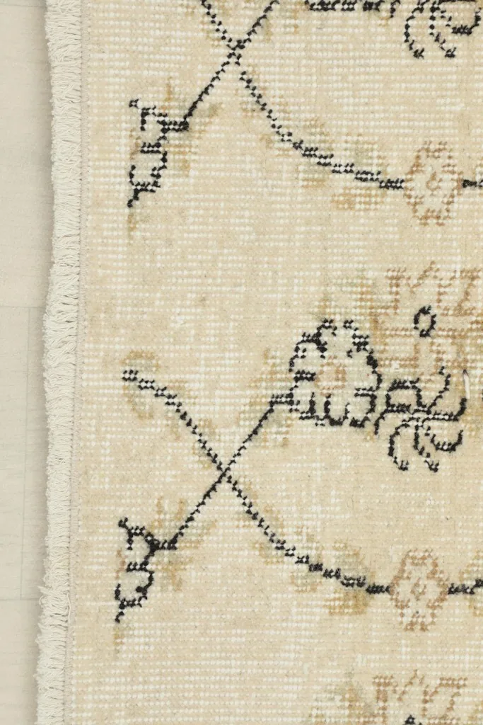 Close-up of the short, natural fringe and edge of the vintage Anatolian rug