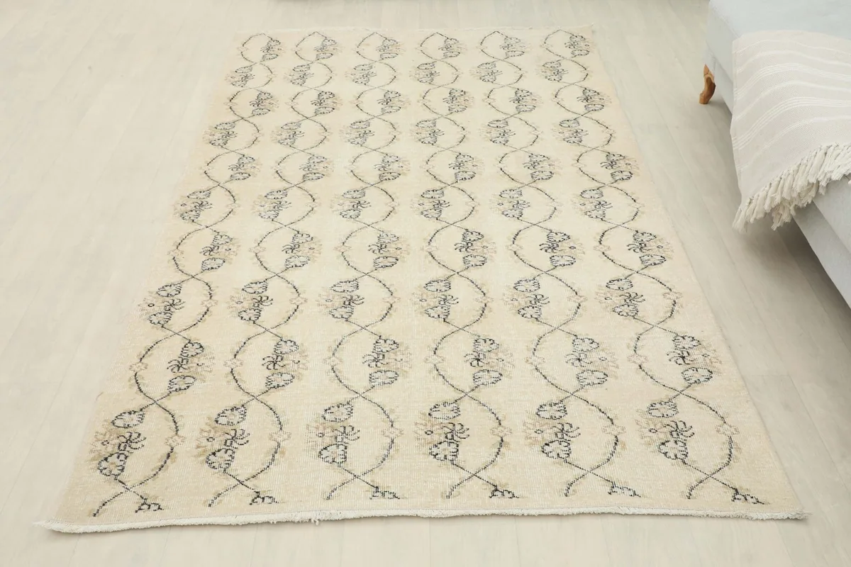Overhead view of the ivory and gray vintage Anatolian rug in a room setting