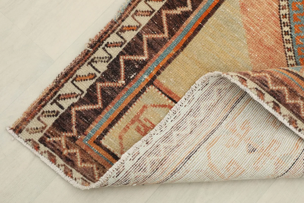 View showing the back of the hand-knotted wool pile on cotton foundation