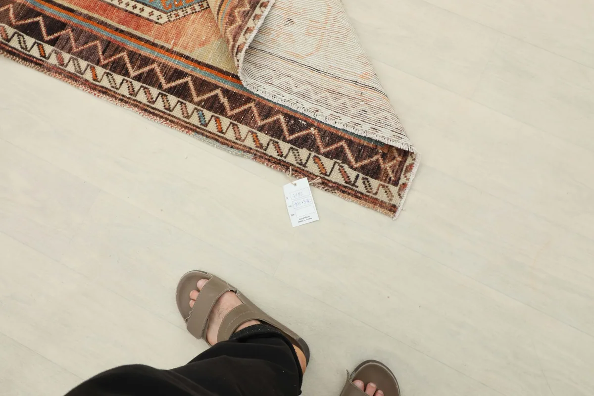 Foot-level view of the rug, illustrating its scale and fit within a home environment
