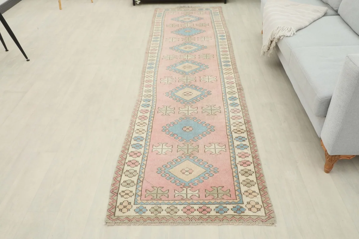 Overhead view of the entire runner rug in a room setting, showcasing its length and pattern