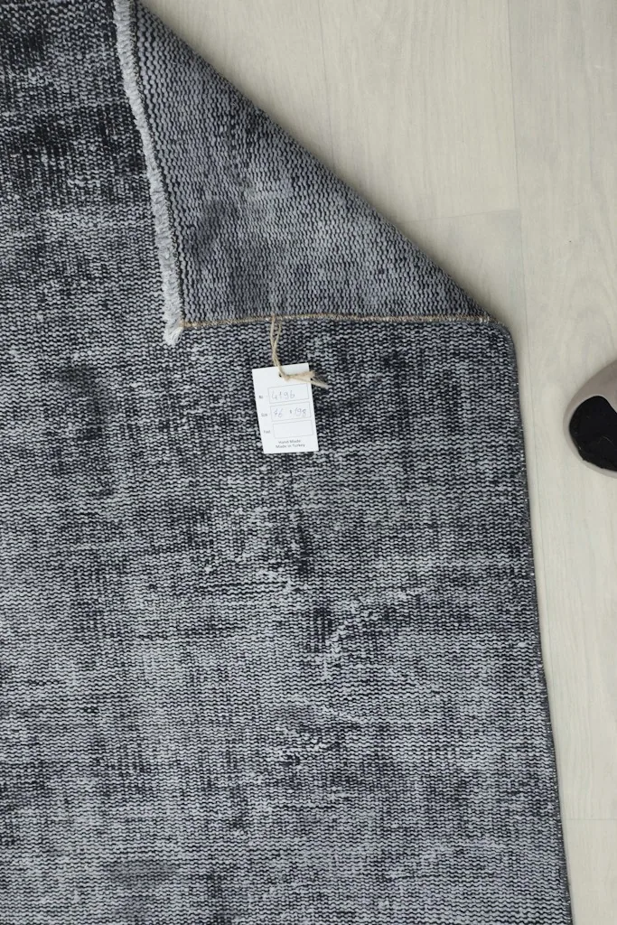 Overhead view of the runner rug with a product tag attached, showcasing its full length and color variations.