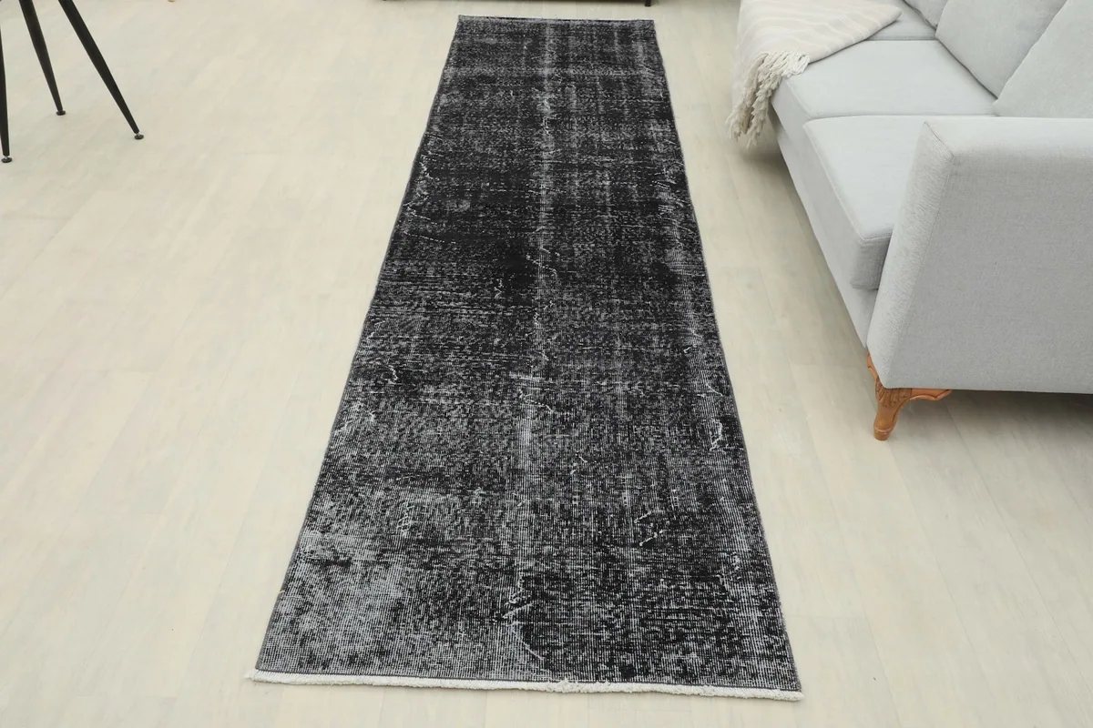 Full view of the charcoal runner rug in a room, complementing a minimalist decor