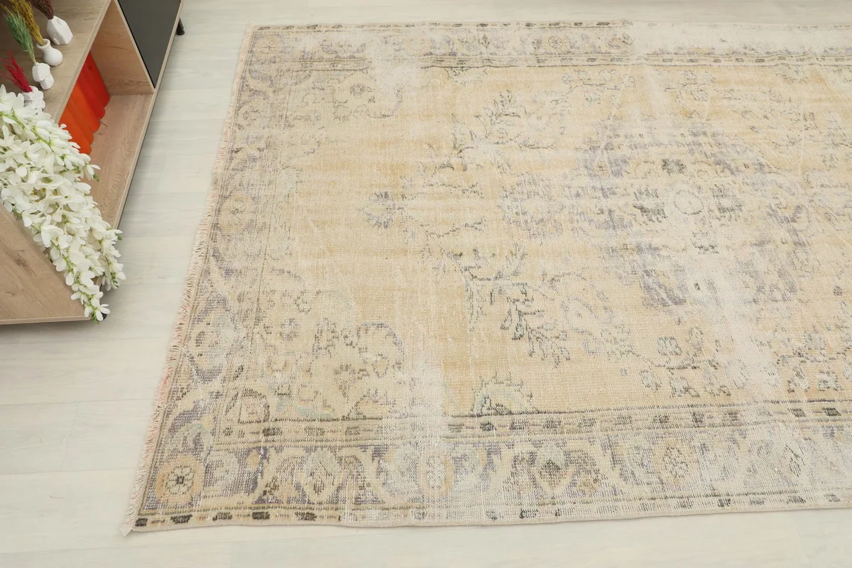 Overhead angle of the rug, capturing the vintage character and subtle color variations across the surface.