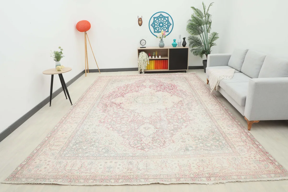 Full room view of the Rose Ivory Medallion Anatolian Rug, showcasing its large size and presence.