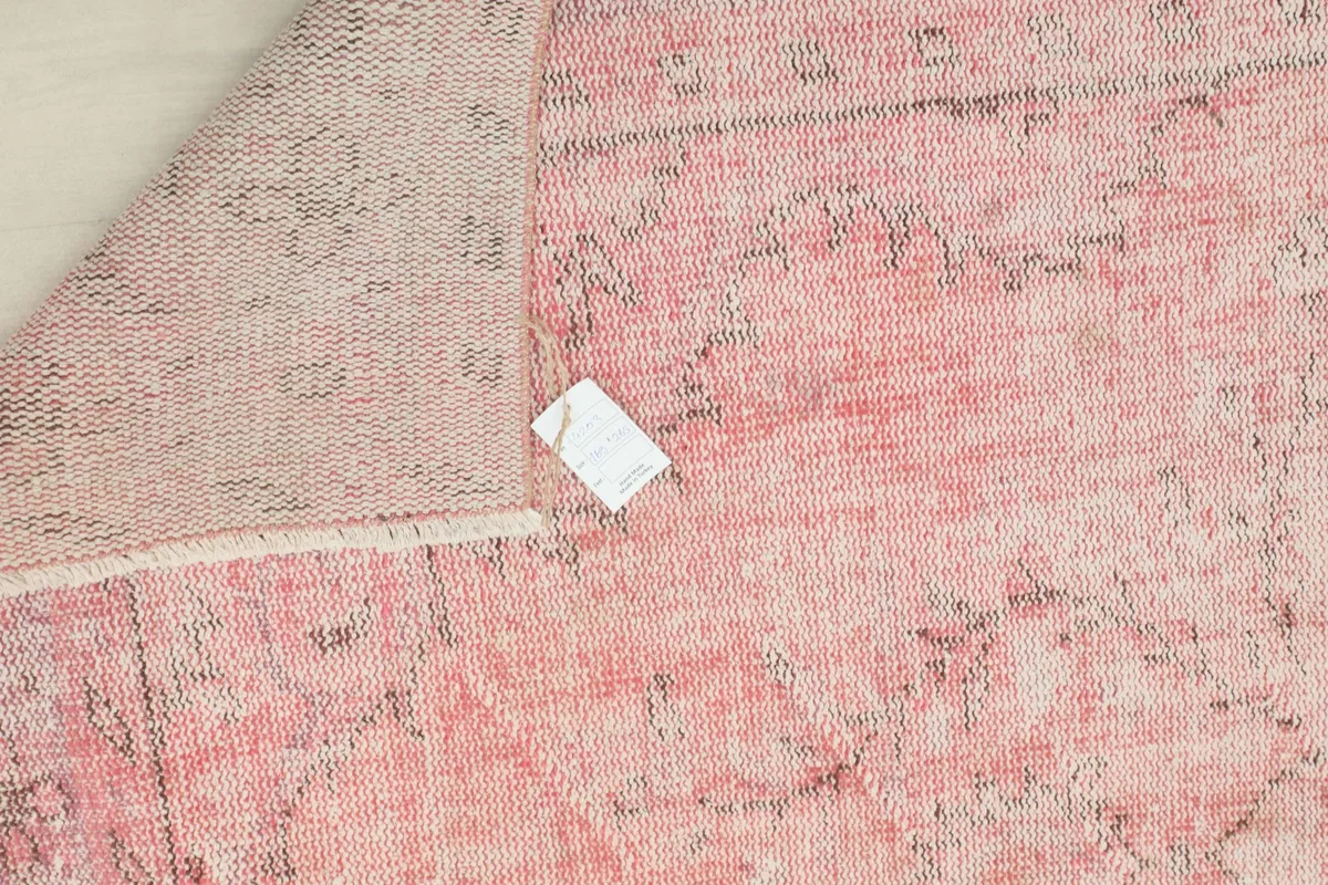 Close-up of the rug's back, detailing the tight hand-knotting and foundation weave.