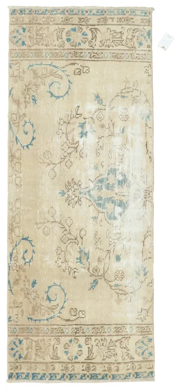 Full top view of the 2'7" x 6'7" beige and blue floral vintage Anatolian runner