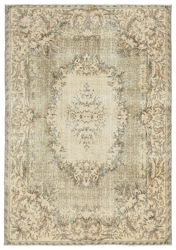 Full top view of the beige and olive vintage Anatolian area rug on a white background.