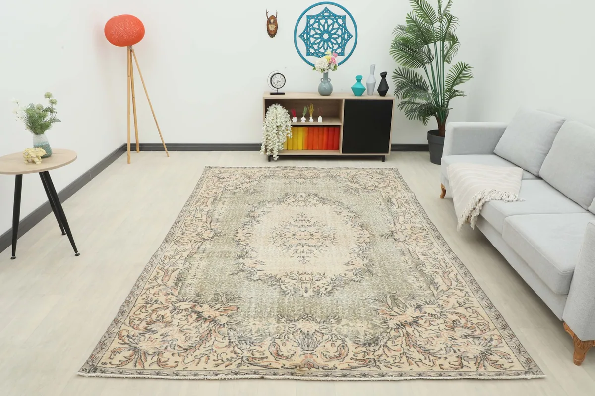 Full room view of the beige and olive rug, demonstrating its impact in a contemporary setting.