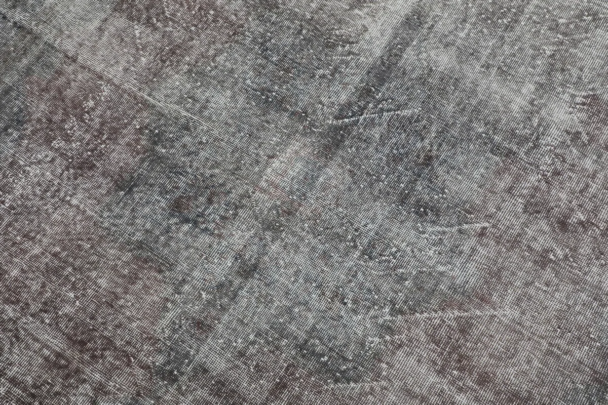 Close-up detail of the distressed pile and subtle color variations