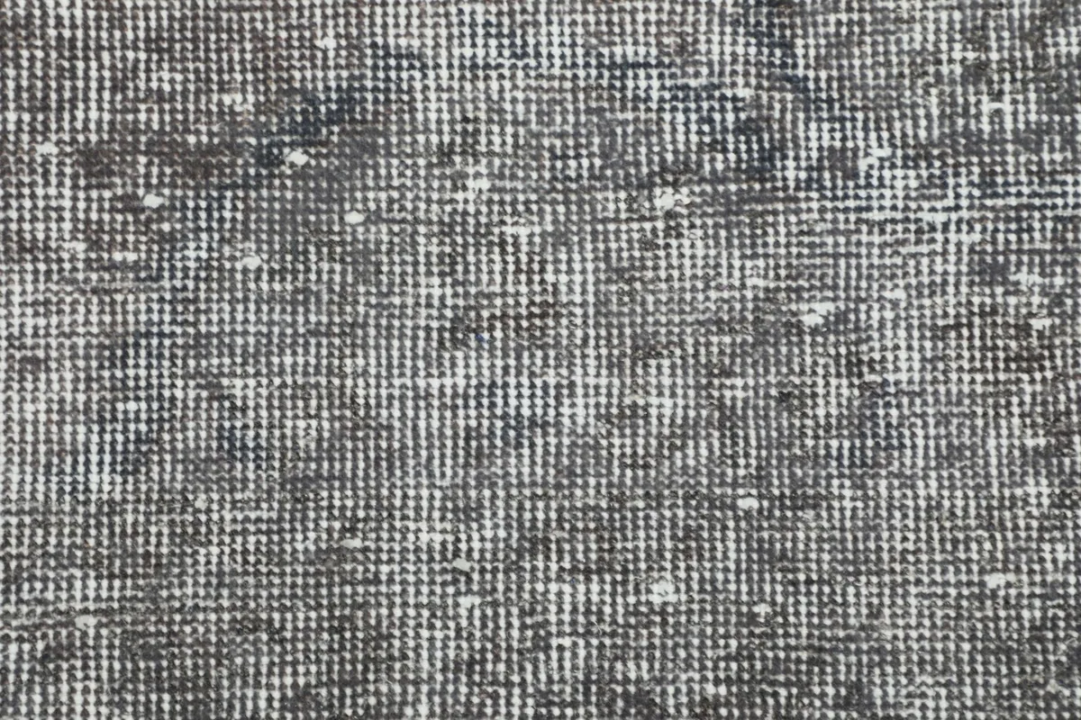 Detailed view of the low wool pile and hand-knotted weave
