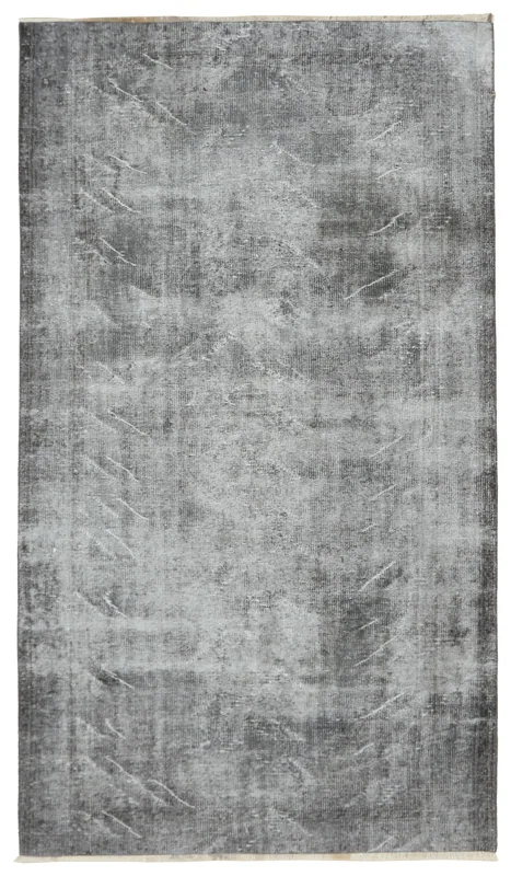 Full top view of the charcoal and gray vintage Anatolian rug on a white background