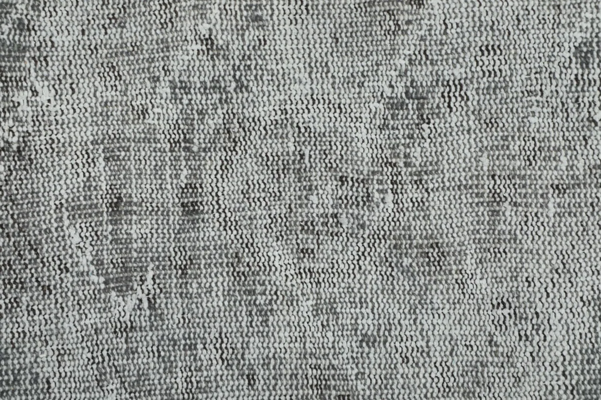 Close-up of the low wool pile, showing the hand-knotted texture and natural wear