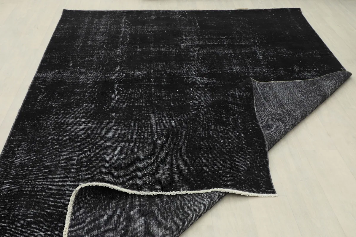 The rug folded back to reveal its thickness and the texture of the reverse side