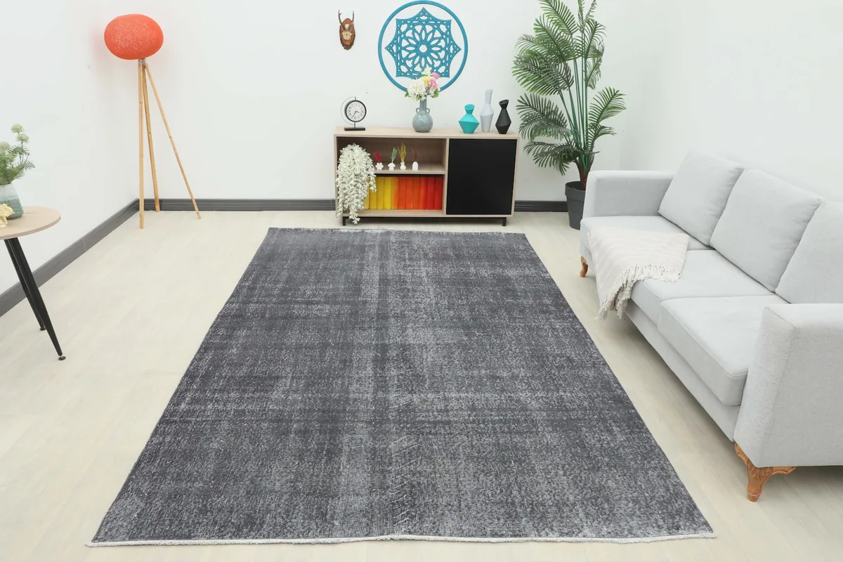 Full room view of the charcoal gray rug, showcasing its presence in the space