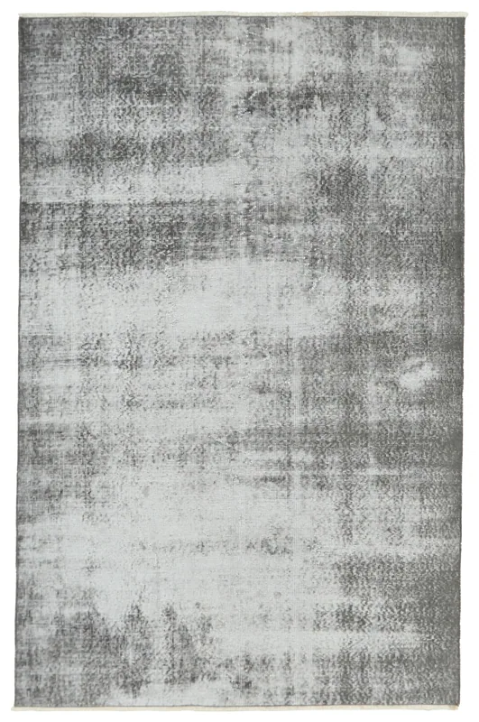 Full overhead view of the charcoal and gray vintage Anatolian rug on a white background.