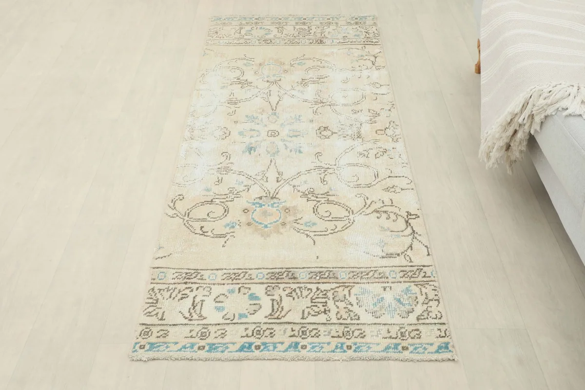 Overhead view of the entire runner rug laid out on a light floor, showing its full design.