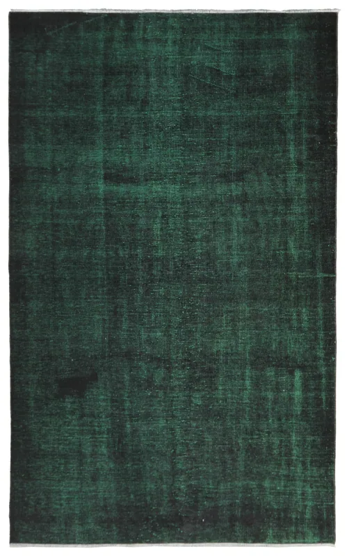 Full overhead view of the 5'5" x 8'10" vintage Anatolian rug with deep green and black tones.
