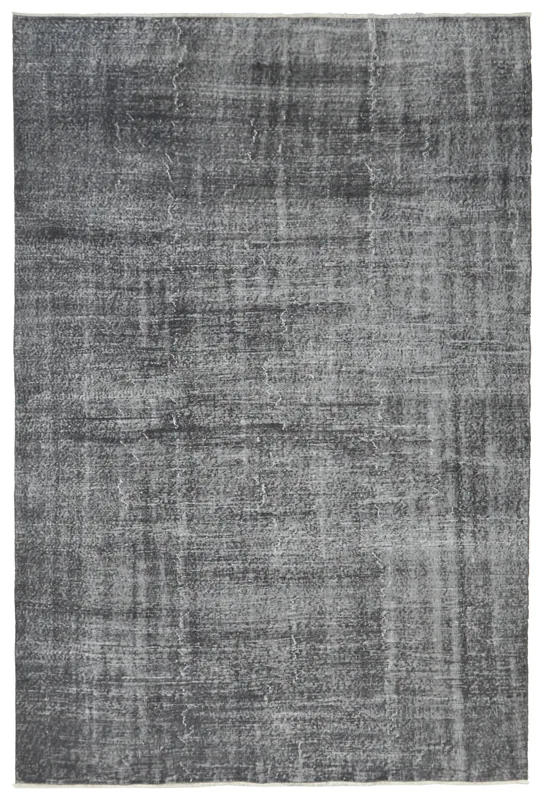 Full top view of the charcoal and gray vintage hand-knotted area rug on a white background.