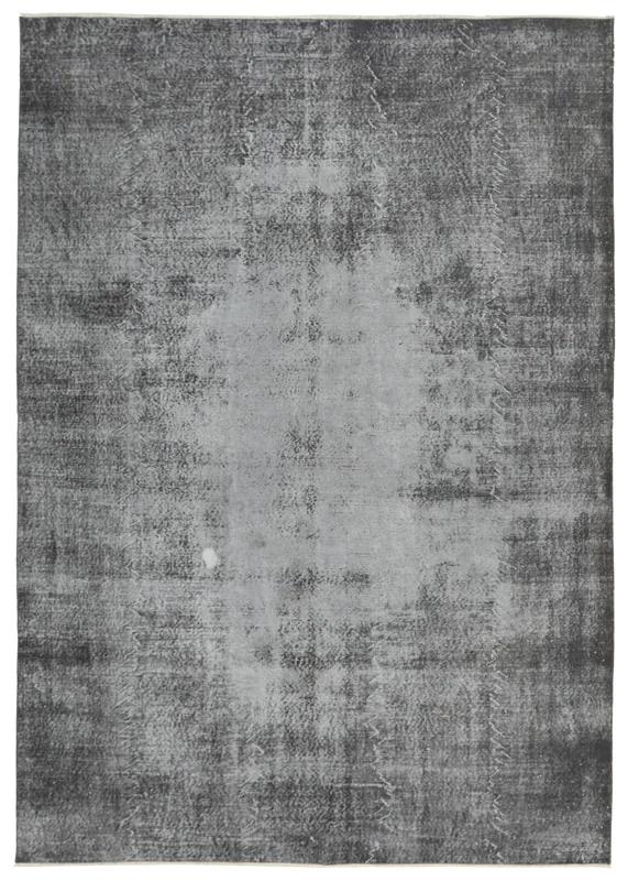 Full top view of the 7'3" x 10'5" charcoal and gray distressed vintage Anatolian area rug