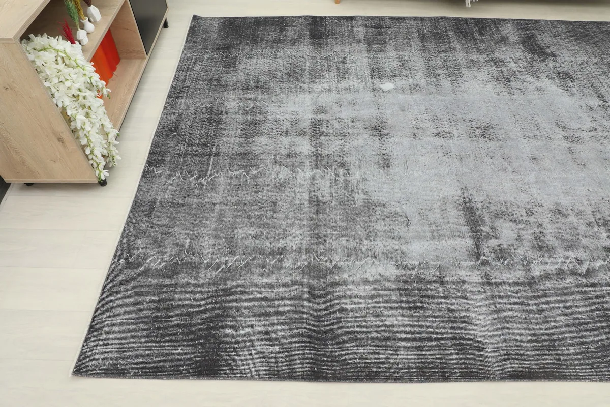 Another angle view highlighting the faded pattern and vintage character of the area rug