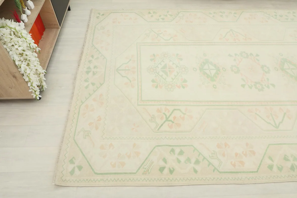 Detailed angle view of the rug's surface, revealing the subtle color variations and hand-knotted texture.