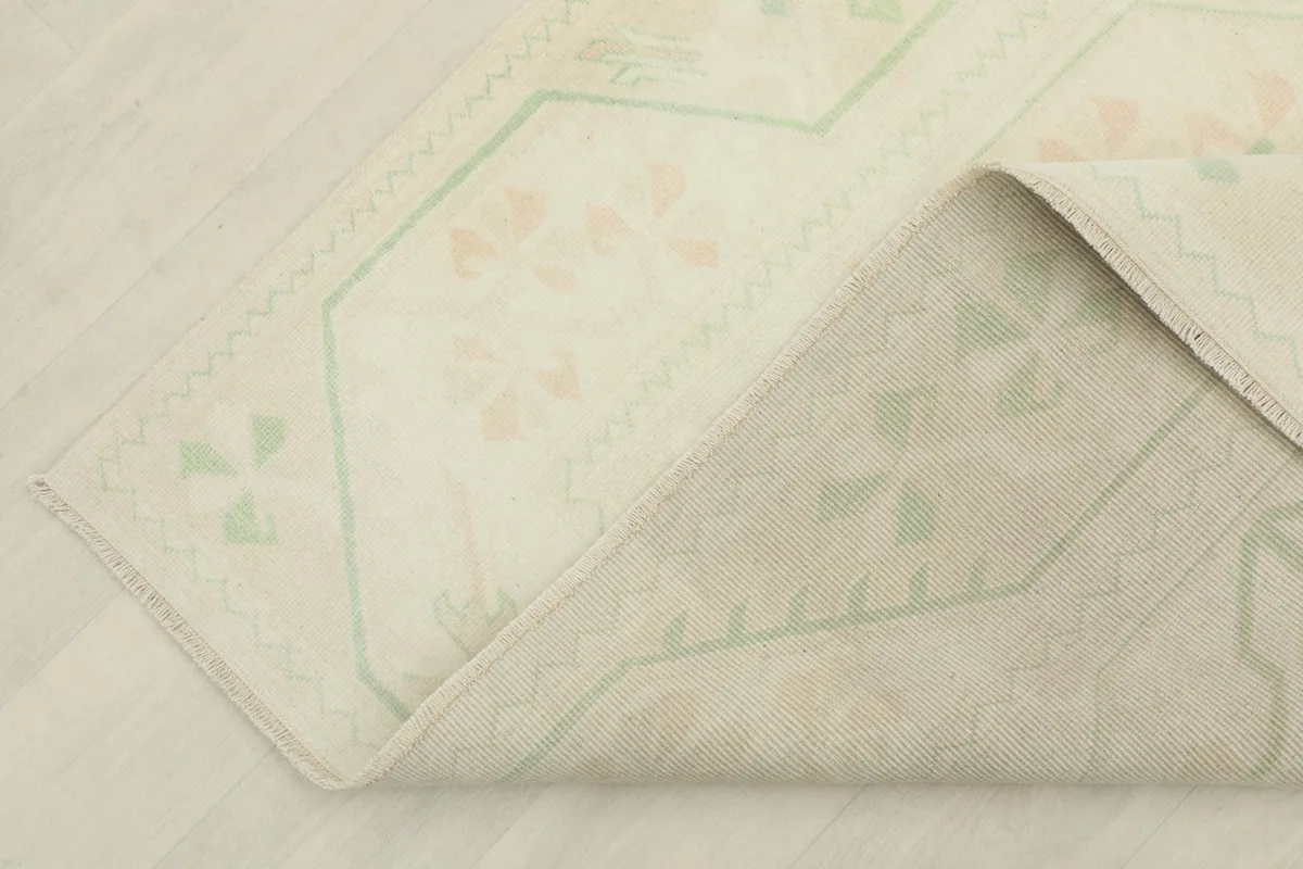 Detailed view of the rug's back, revealing the tight knotting and craftsmanship from Anatolia.