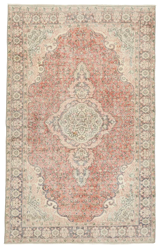 Full top view of the 6'6" x 10'3" vintage Anatolian rug with a rust field and central medallion.