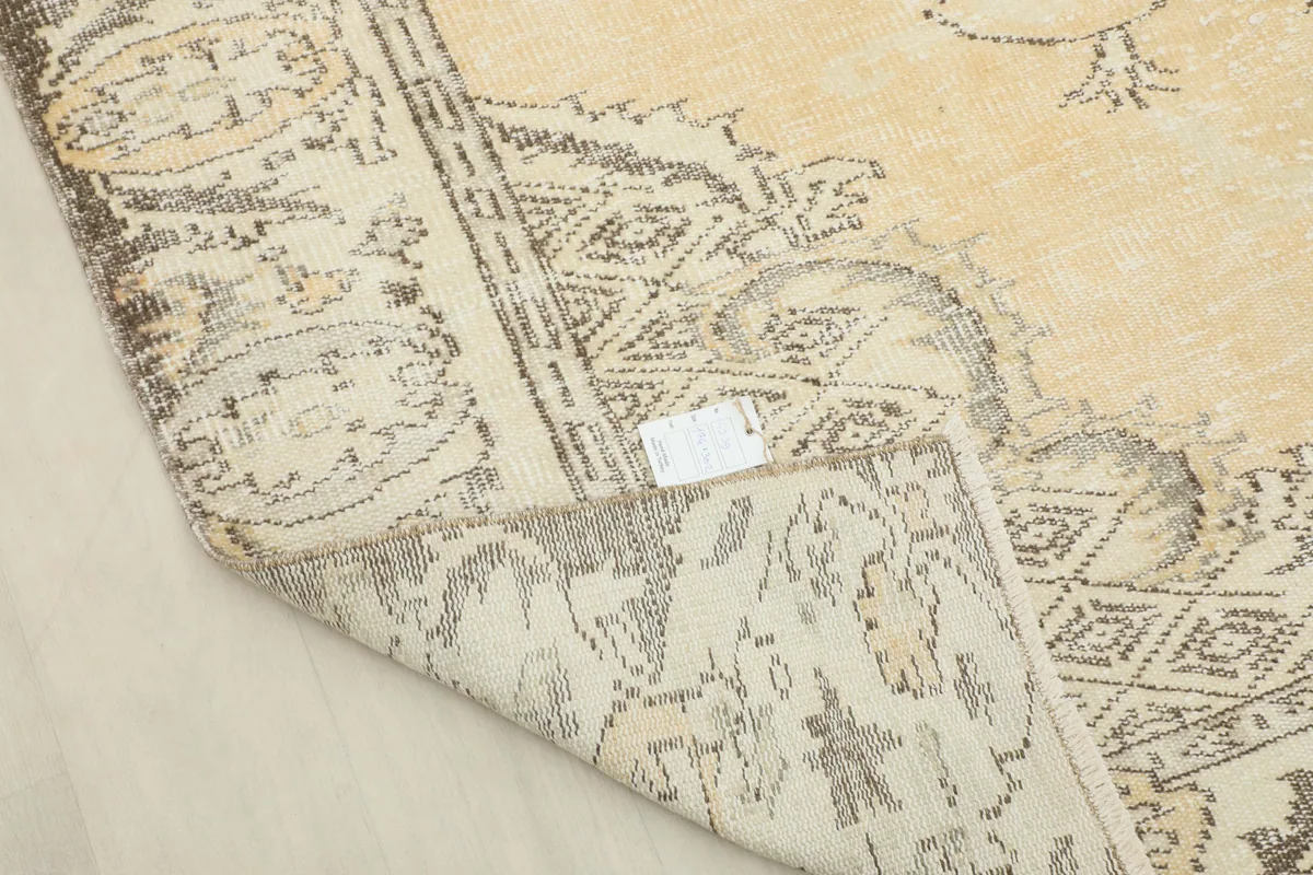 Detailed view of the back of the Beige Medallion Anatolian Rug, showing the tight knotting and foundation.