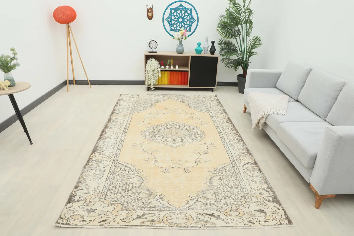 Full room view of the Beige Medallion Anatolian Rug, demonstrating its large size and placement in a contemporary space.