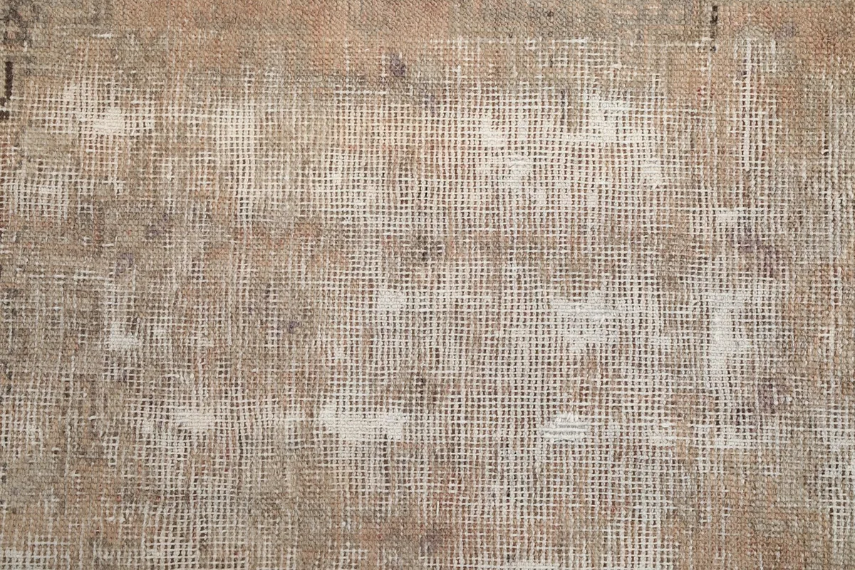 Overhead close-up of the low wool pile and underlying cotton foundation weave