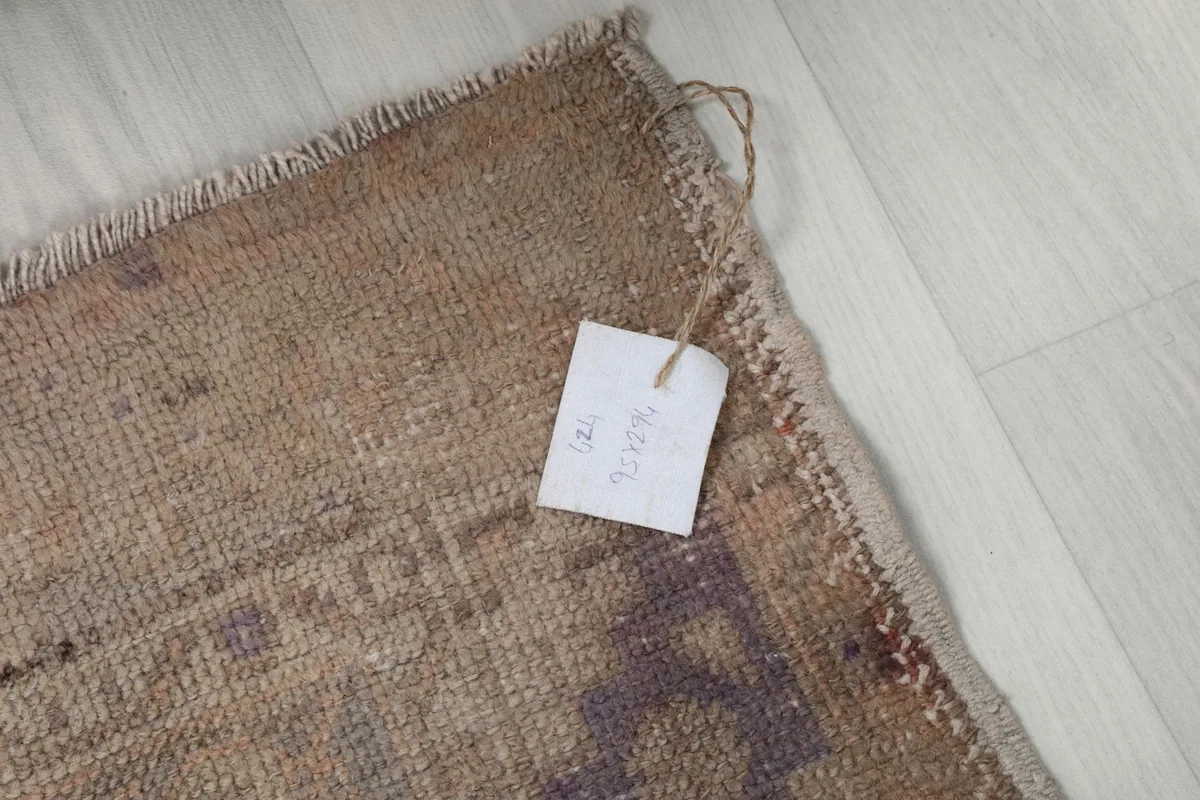 Small tag attached to the corner of the rug, indicating its unique product number