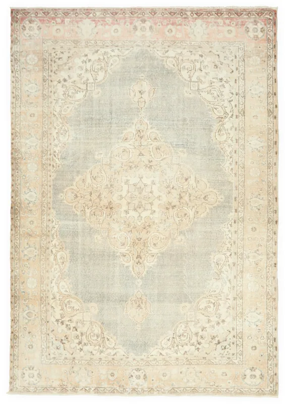 Full top view of the 6'8" x 9'8" vintage Anatolian rug with blue field, beige medallion, and rose border