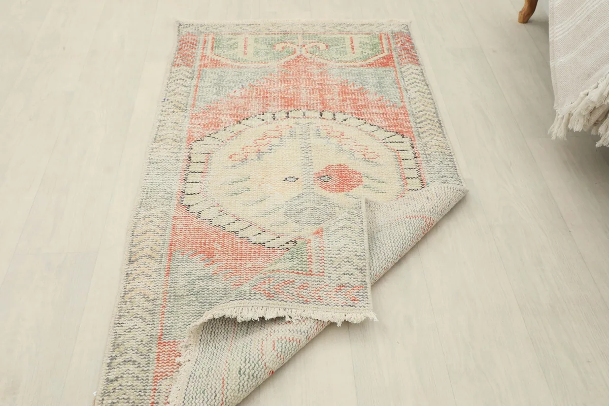 The rug partially folded to show the flexibility and construction from an overhead perspective.