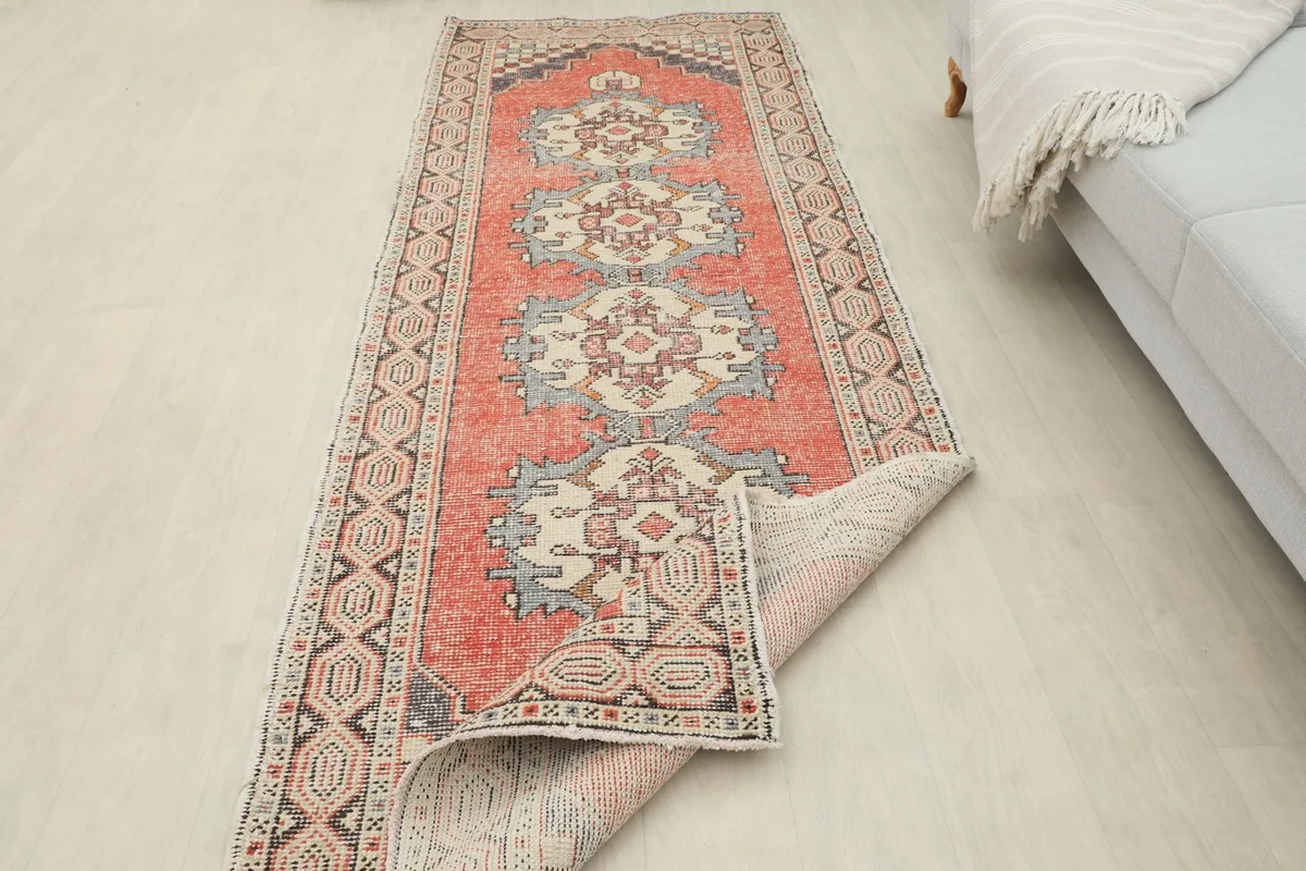 Runner partially folded to show the back and front texture in a room setting