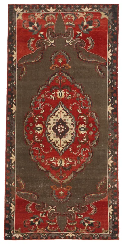 Full overhead view of the gray and red vintage Anatolian rug on a white background