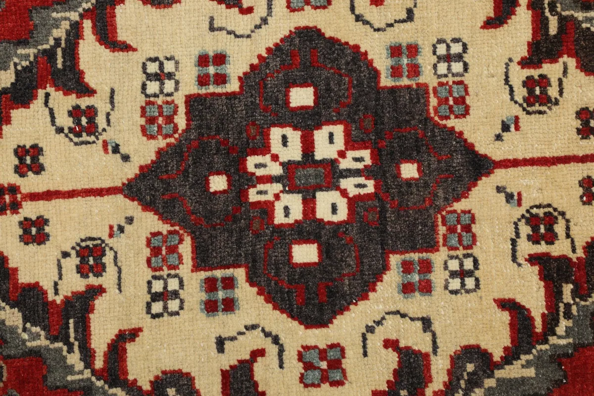 Extreme close-up of the intricate patterns within the ivory section of the medallion