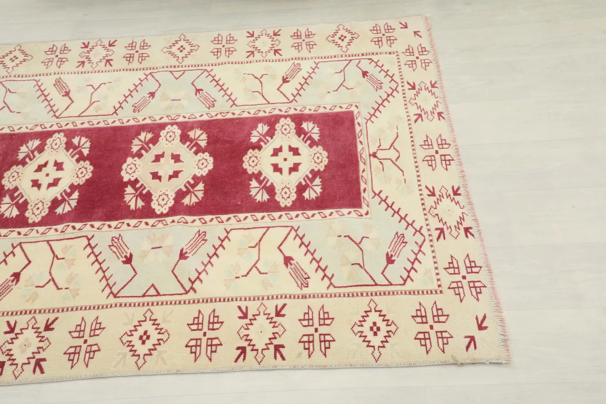 Close-up corner view of the Rose Geometric Anatolian Rug, showing the main border and field patterns.