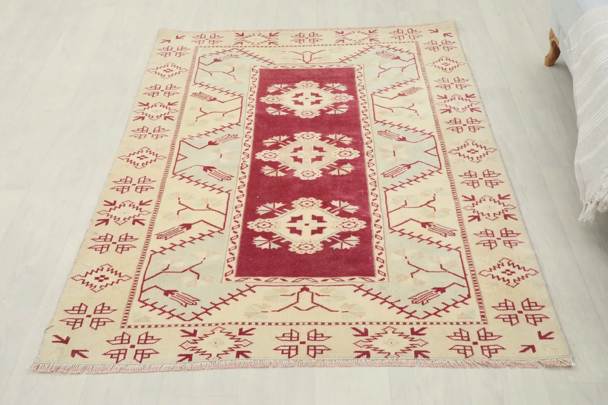 Full view of the Rose Geometric Anatolian Rug from a slightly elevated angle, showing its complete design.