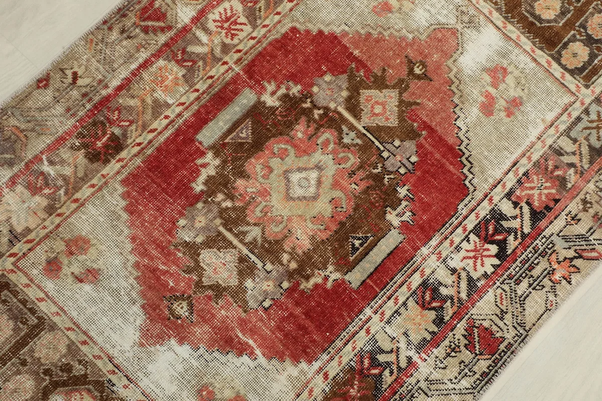 Detailed overhead view of the central red medallion and surrounding geometric patterns