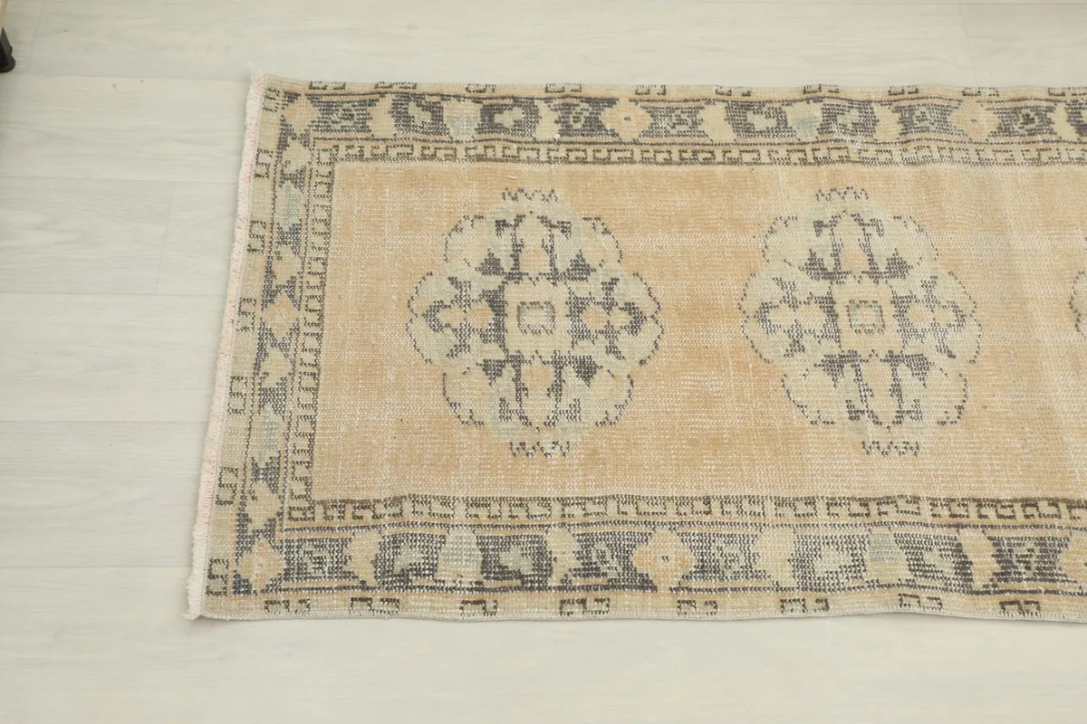 Another angled view highlighting the border pattern and central medallions on the runner
