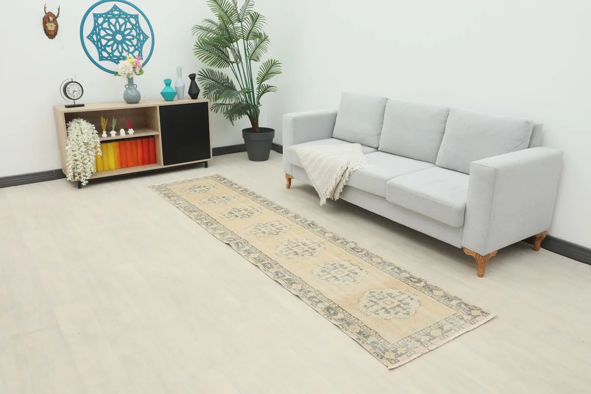 Runner rug displayed in a modern living space with a light sofa and side table