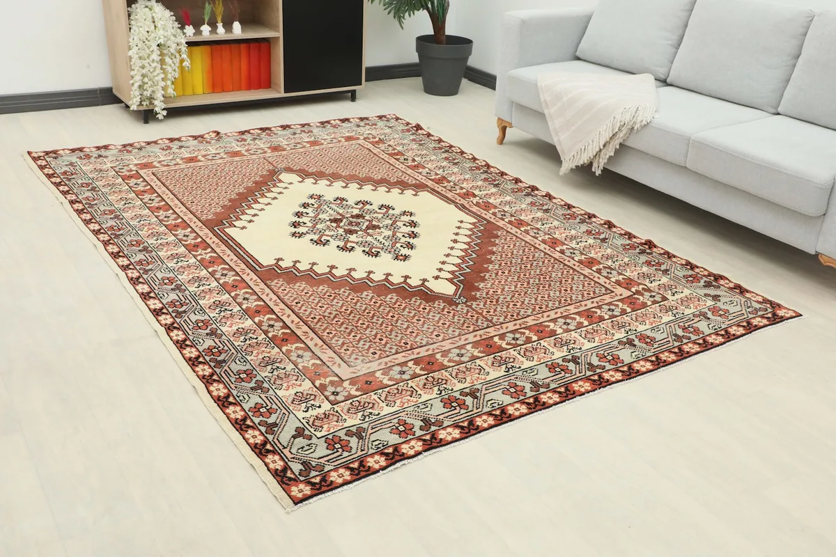 Angle view of the rug in a living room, showcasing its placement relative to a sofa.